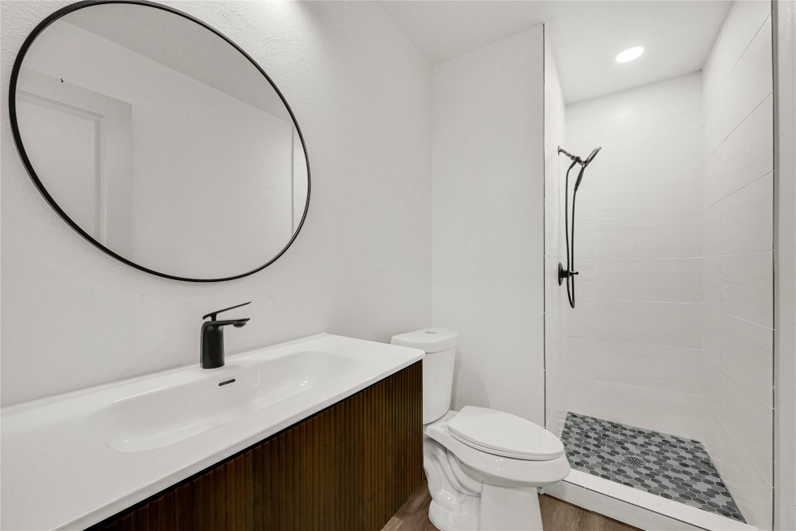 4331 Herridge Street Houston, TX 77022 - Photo 24 of 32 a bathroom with a sink toilet and a mirror