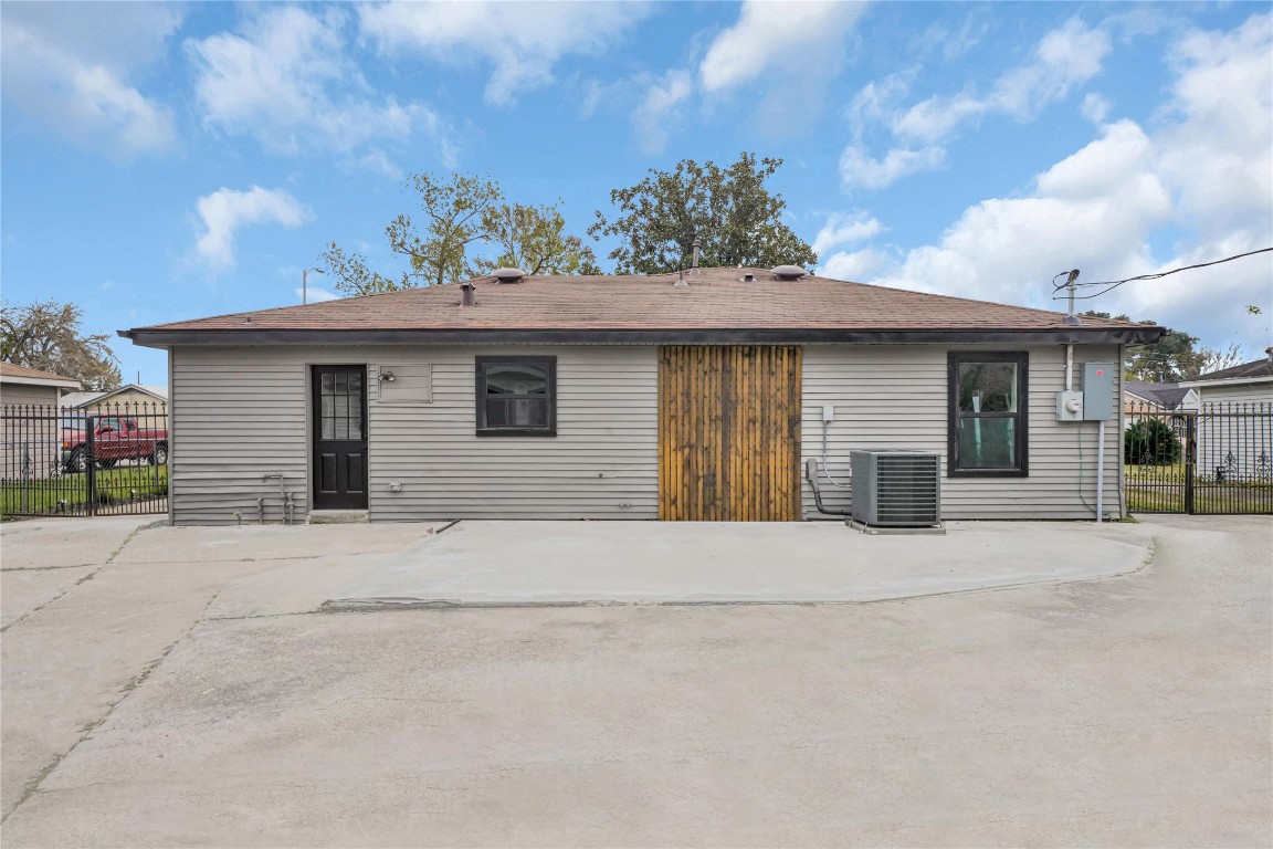 4331 Herridge Street Houston, TX 77022 - Photo 29 of 32 a front view of a house with a yard and garage