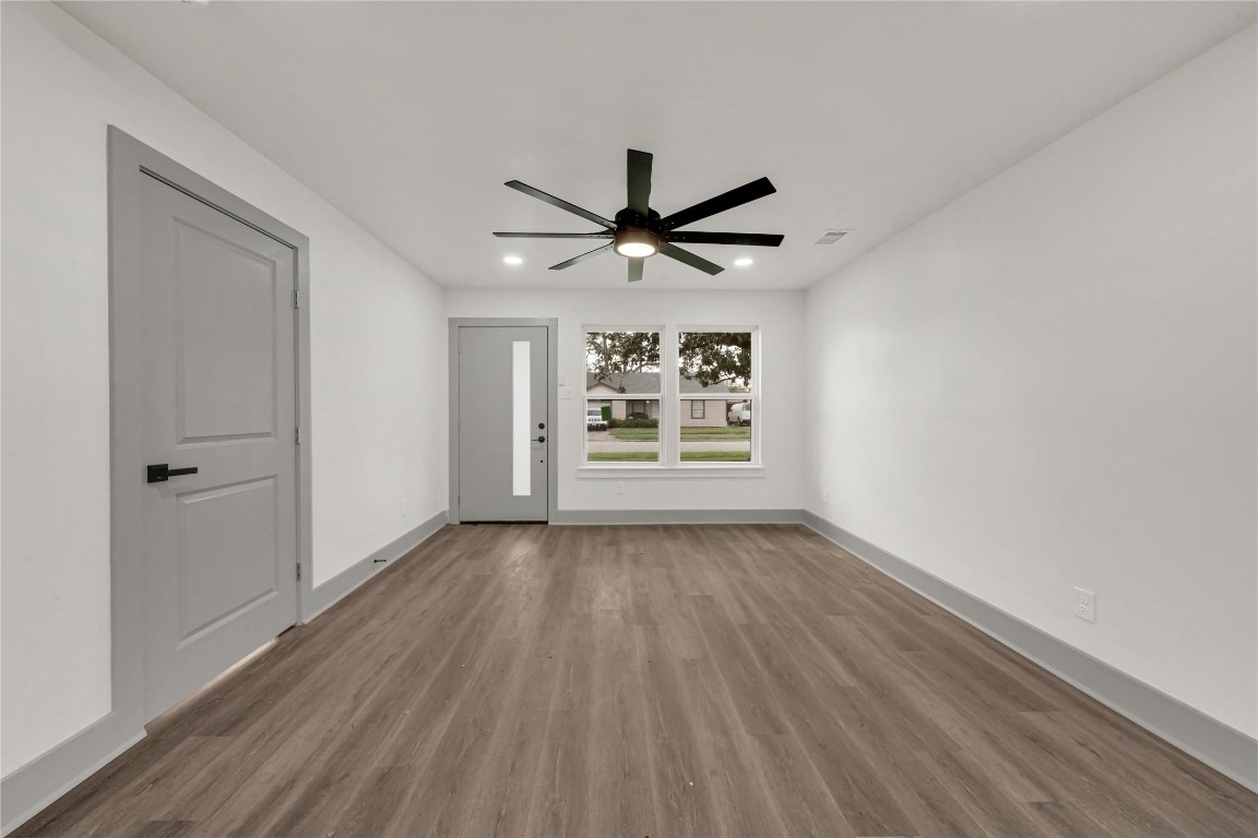 4331 Herridge Street Houston, TX 77022 - Photo 4 of 32 a view of room with window ceiling fan and hardwood floor