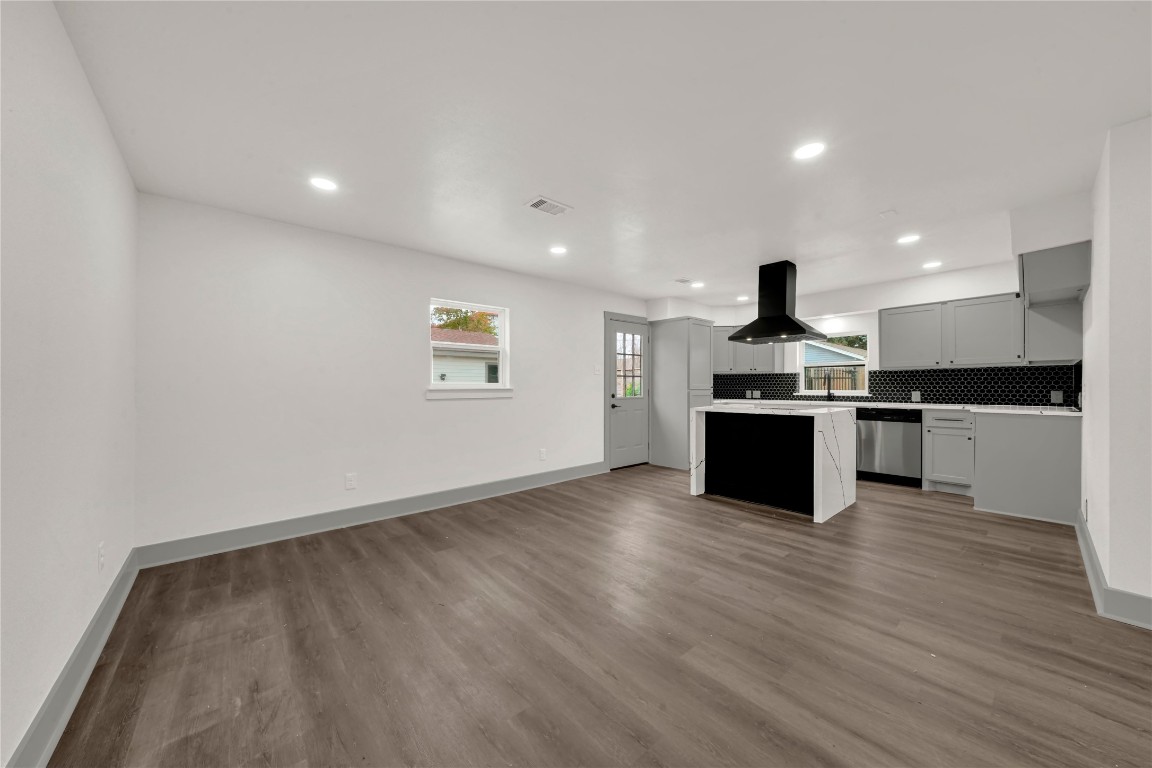 4331 Herridge Street Houston, TX 77022 - Photo 5 of 32 a view of kitchen with wooden floor and stainless steel appliances