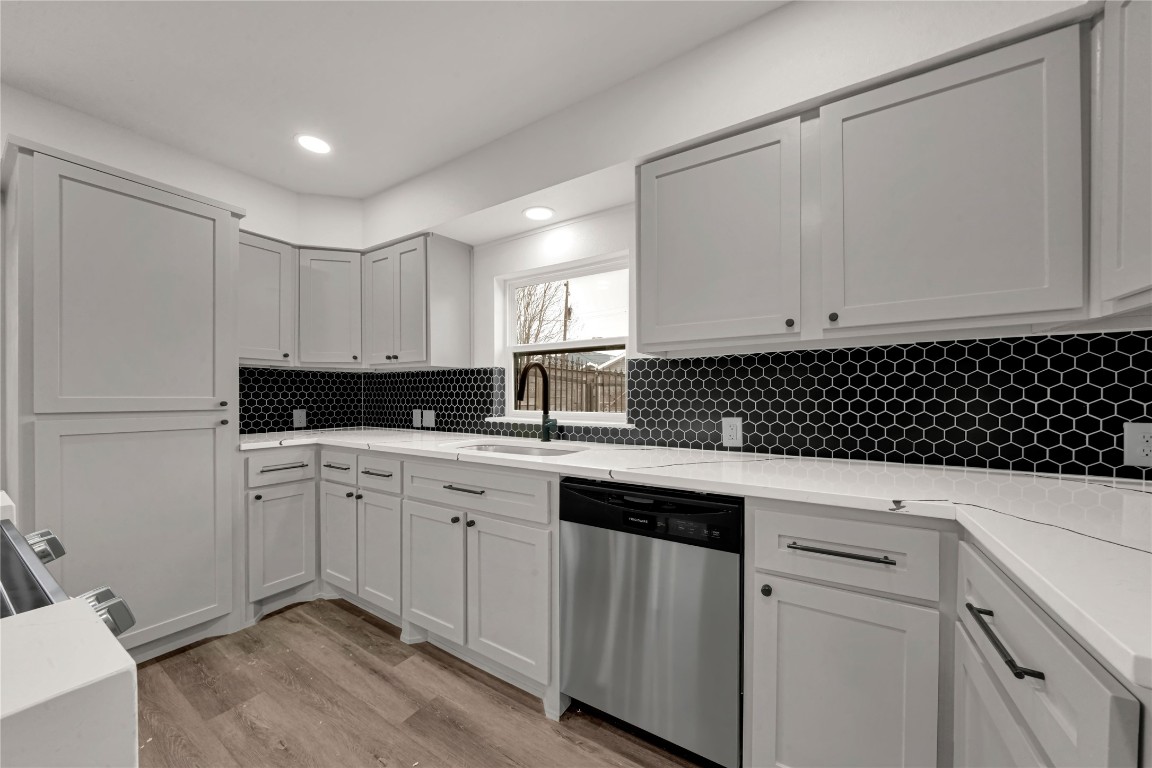 4331 Herridge Street Houston, TX 77022 - Photo 7 of 32 a kitchen with a sink and cabinets
