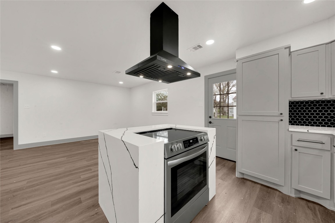 4331 Herridge Street Houston, TX 77022 - Photo 8 of 32 a kitchen with granite countertop a stove and a sink