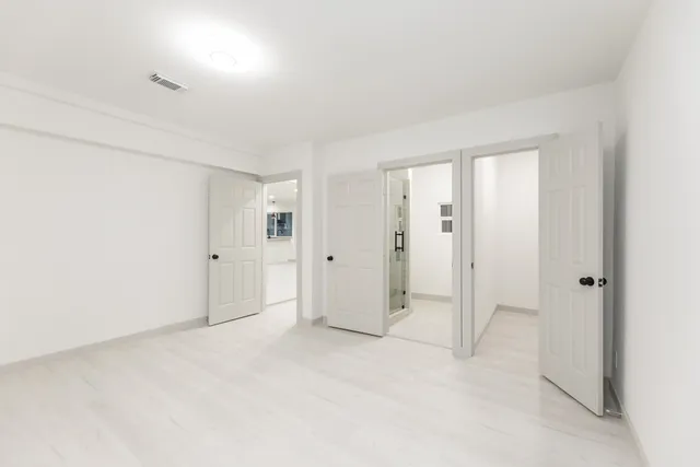 an empty room with a bathroom