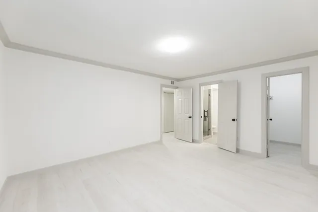 a bathroom with a granite countertop sink a shower and a mirror