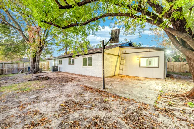 a view of a house with a snow on the road