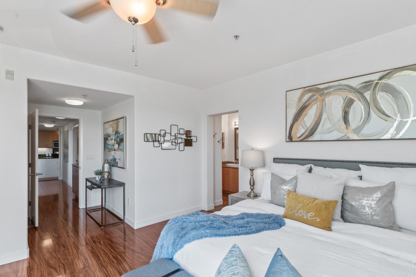 5501 De Marcus Boulevard, Unit 519 Dublin, CA 94568 - Photo 21 of 31 a bedroom with a bed and wooden floor