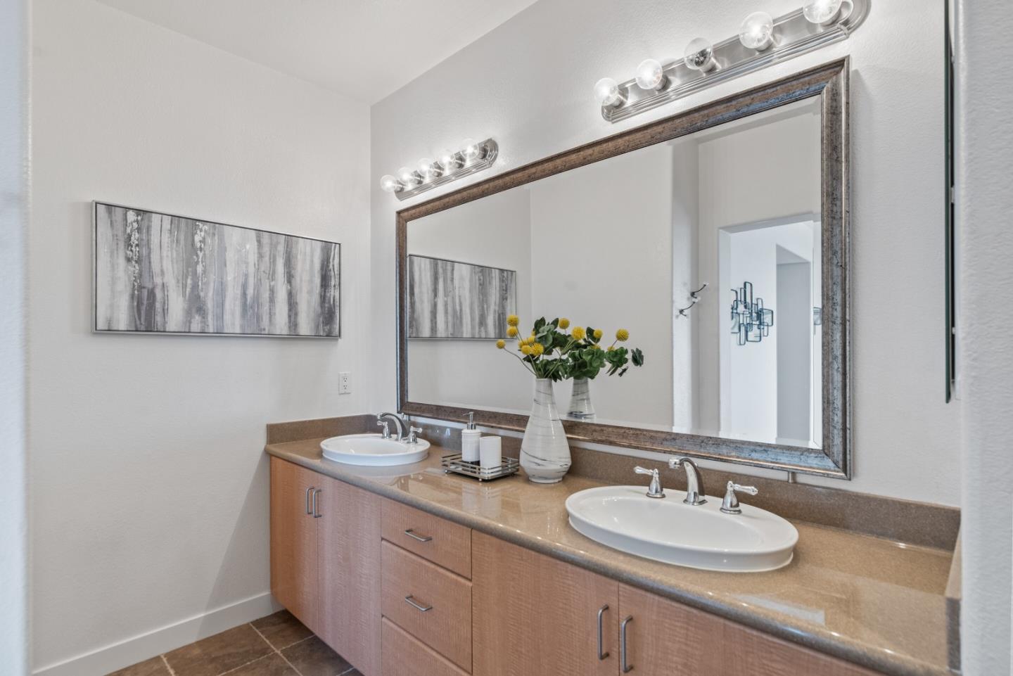5501 De Marcus Boulevard, Unit 519 Dublin, CA 94568 - Photo 22 of 31 a bathroom with a granite countertop sink a mirror and vanity