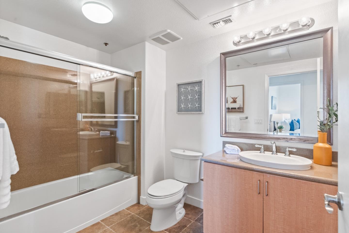 5501 De Marcus Boulevard, Unit 519 Dublin, CA 94568 - Photo 25 of 31 a bathroom with a bathtub shower sink vanity and toilet