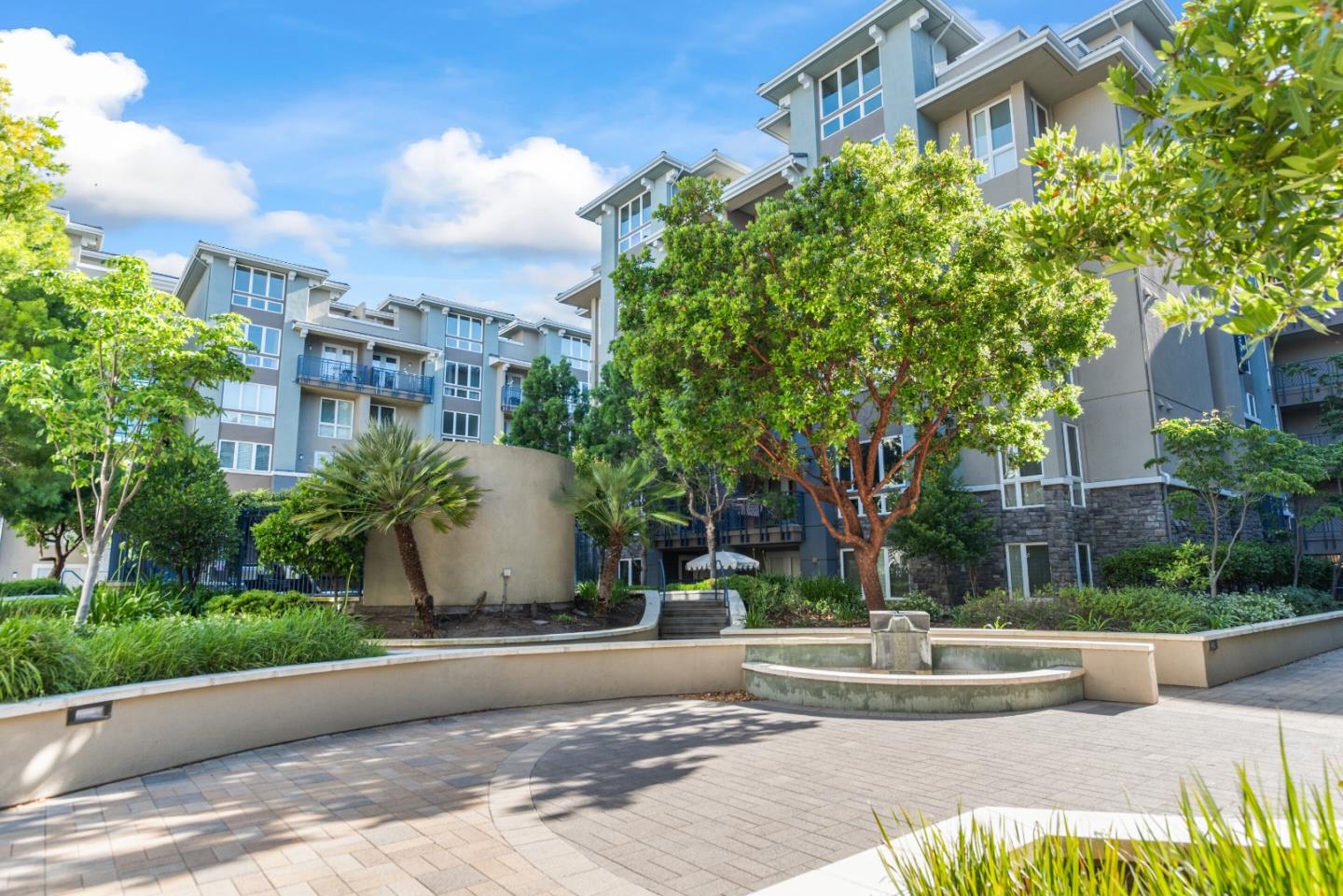 5501 De Marcus Boulevard, Unit 519 Dublin, CA 94568 - Photo 28 of 31 a front view of a building with garden and trees