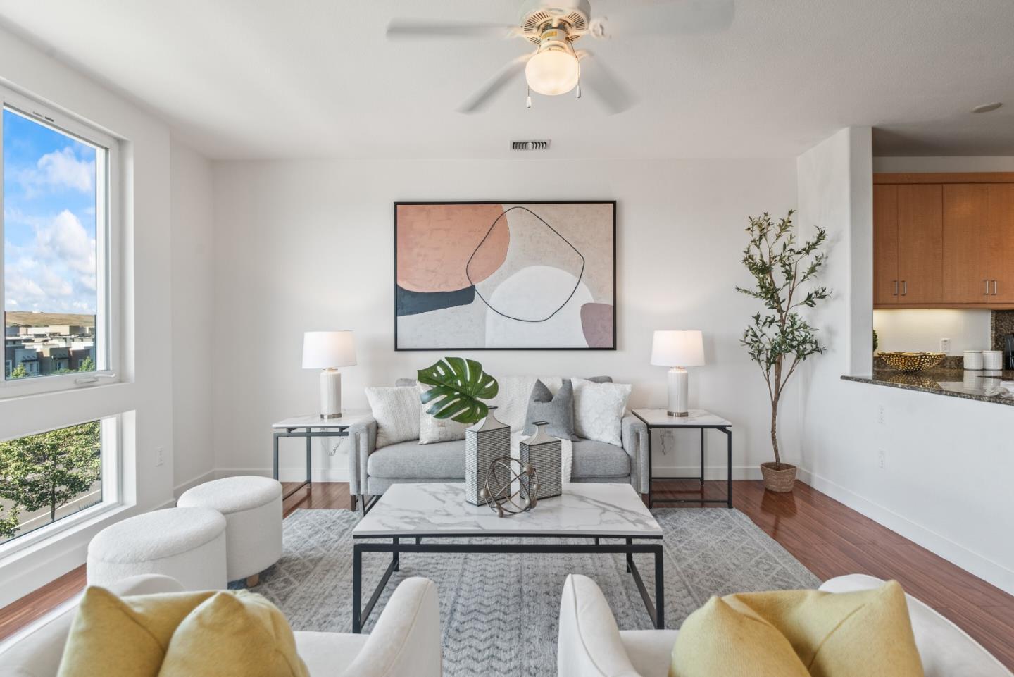 5501 De Marcus Boulevard, Unit 519 Dublin, CA 94568 - Photo 6 of 31 a living room with furniture and a potted plant