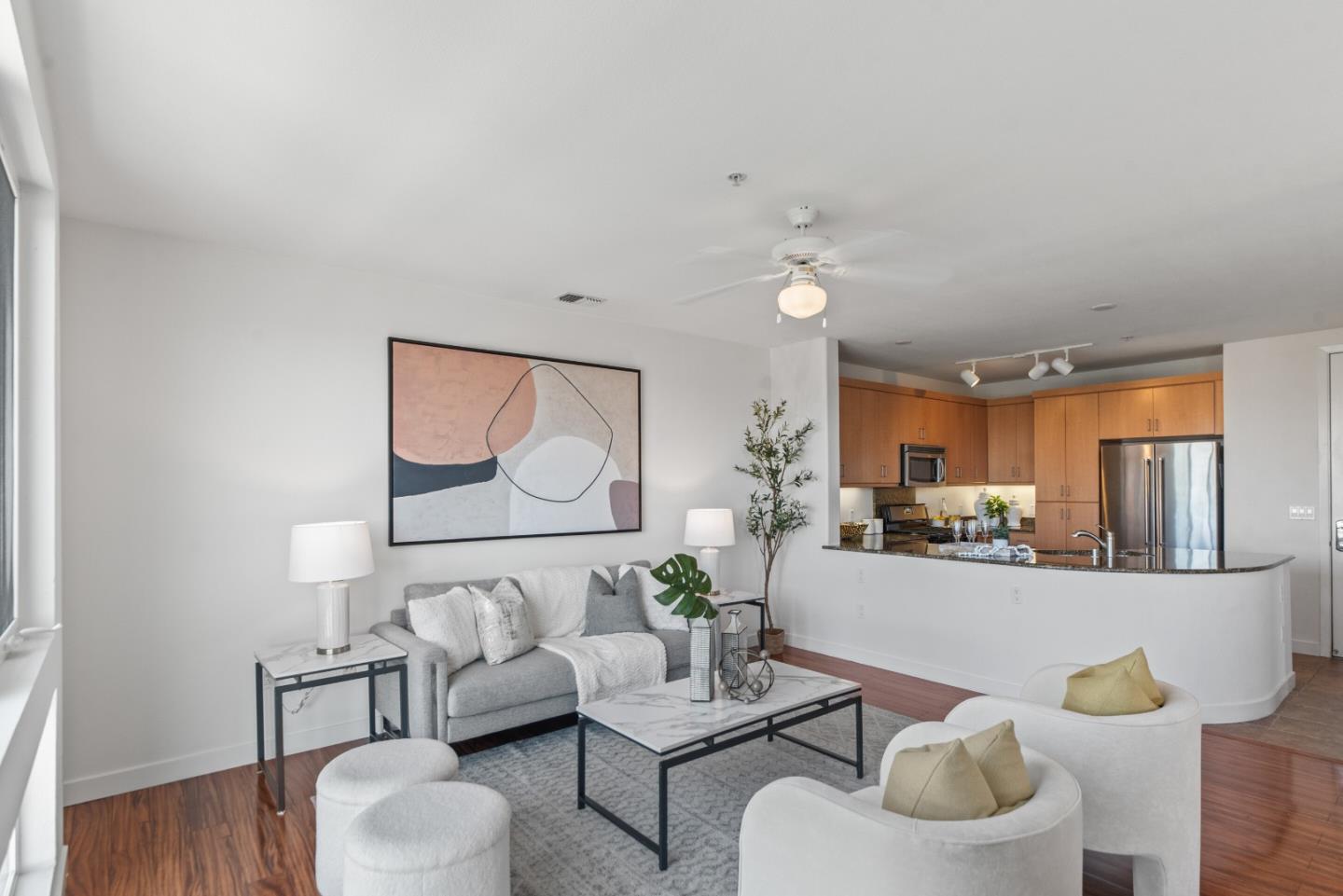 5501 De Marcus Boulevard, Unit 519 Dublin, CA 94568 - Photo 7 of 31 a living room with furniture and a wooden floor