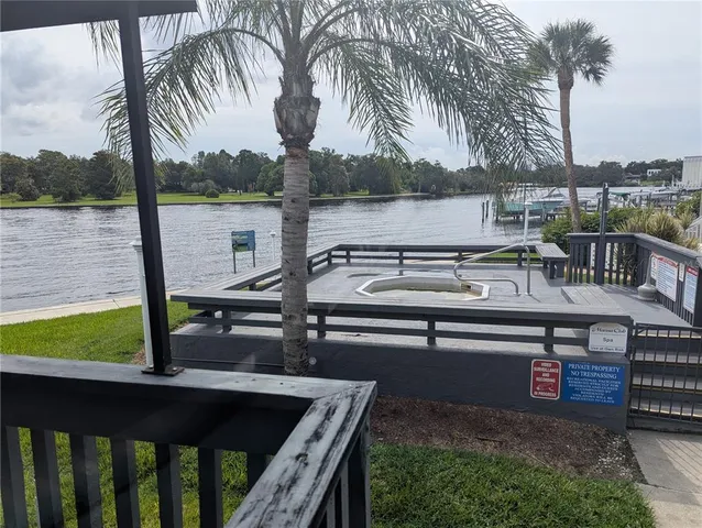a view of a roof deck with couches and wooden floor