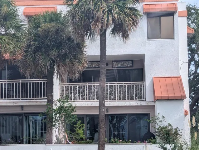 a view of front of house with deck and outdoor space