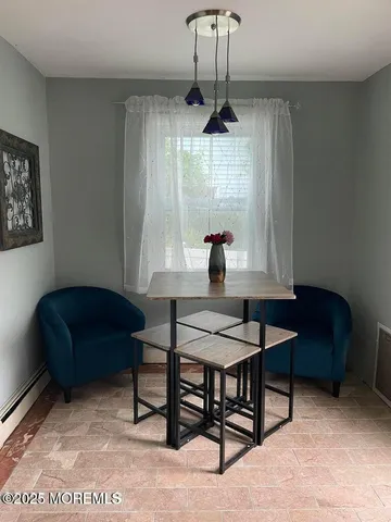 a view of a livingroom with furniture and window