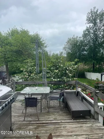 a view of a chairs and table on the terrace