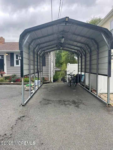 a view of a porch with furniture and backyard