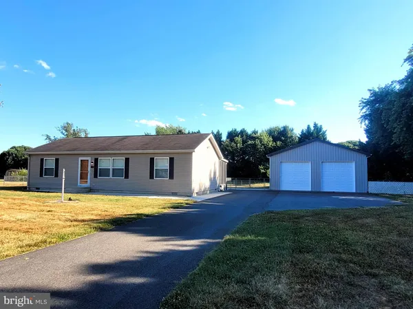 a view of a house with pool and yard