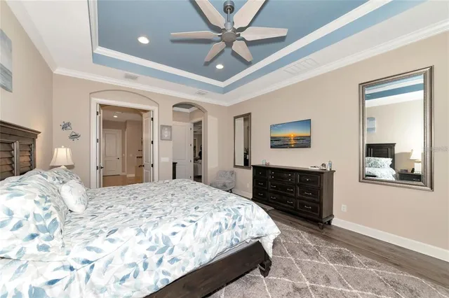 a bedroom with a bed dresser and a window