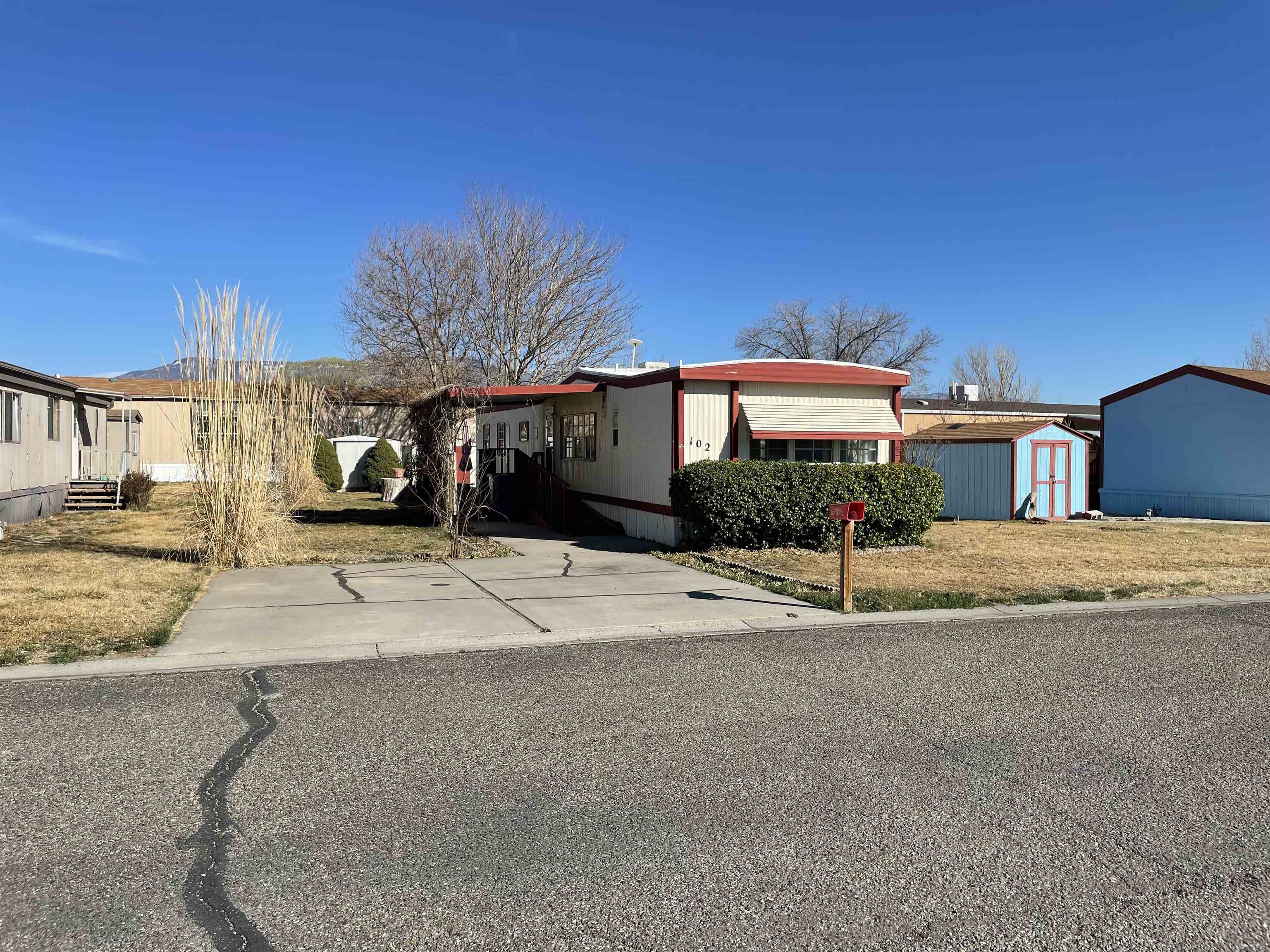 3251 E Road, Unit 102 Clifton, CO 81520 - Photo 3 of 14 a view of a house with a street