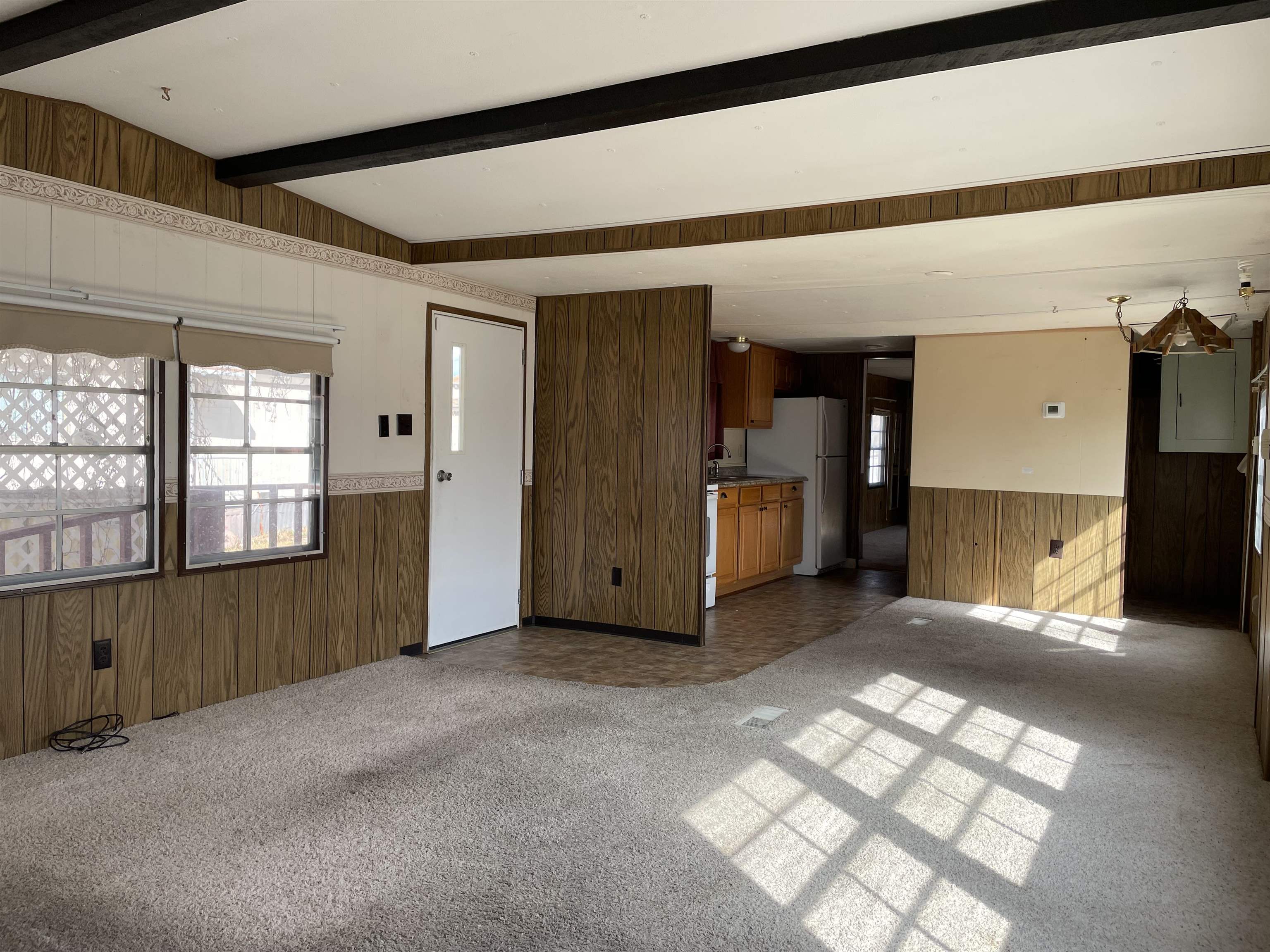 3251 E Road, Unit 102 Clifton, CO 81520 - Photo 4 of 14 an empty room with windows