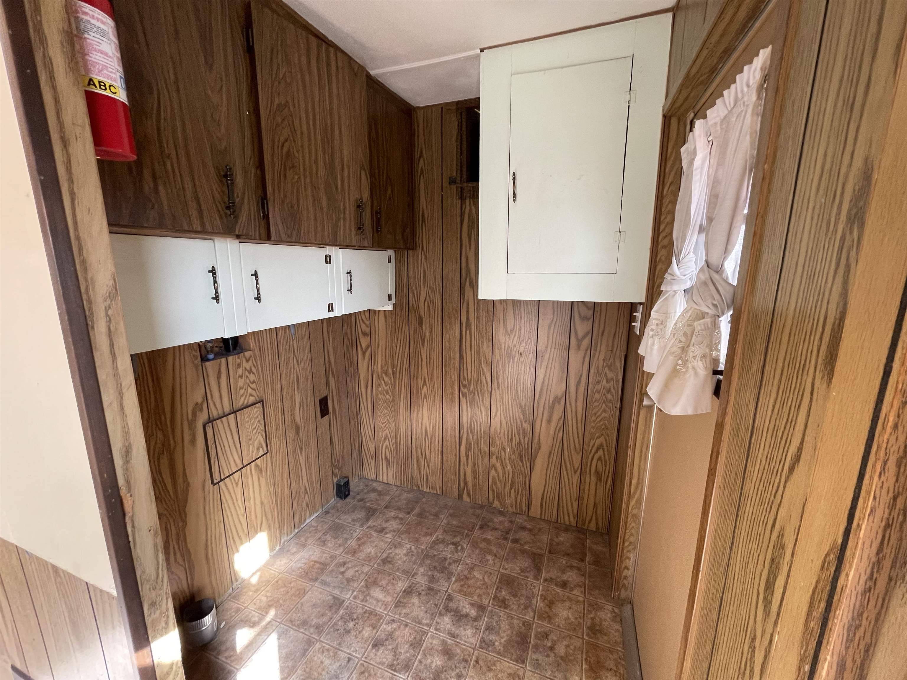 3251 E Road, Unit 102 Clifton, CO 81520 - Photo 7 of 14 a view of an entryway with wooden walls