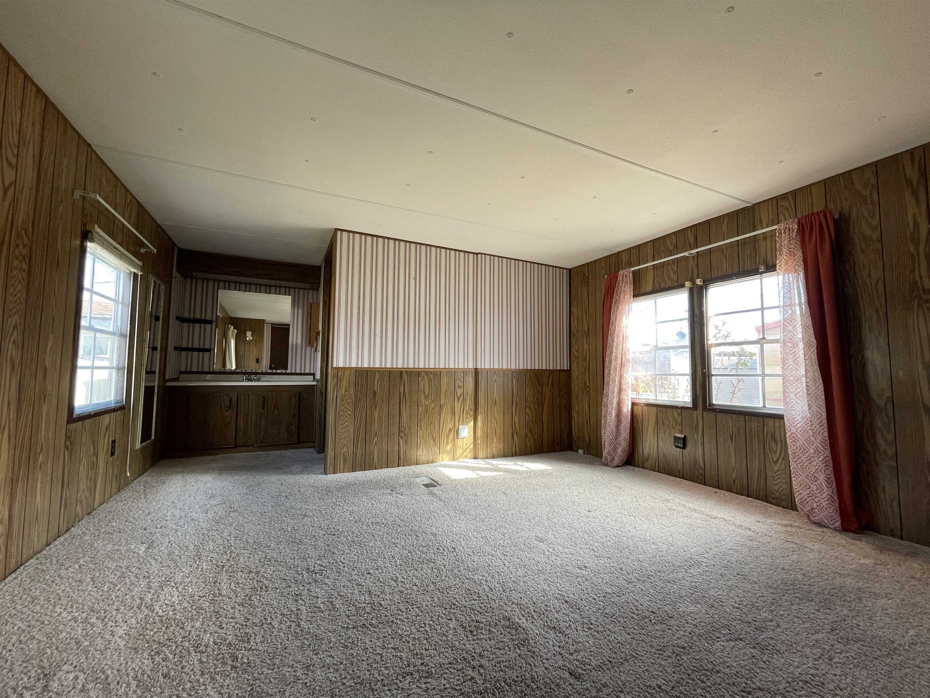 3251 E Road, Unit 102 Clifton, CO 81520 - Photo 8 of 14 a view of an empty room with a window and fireplace