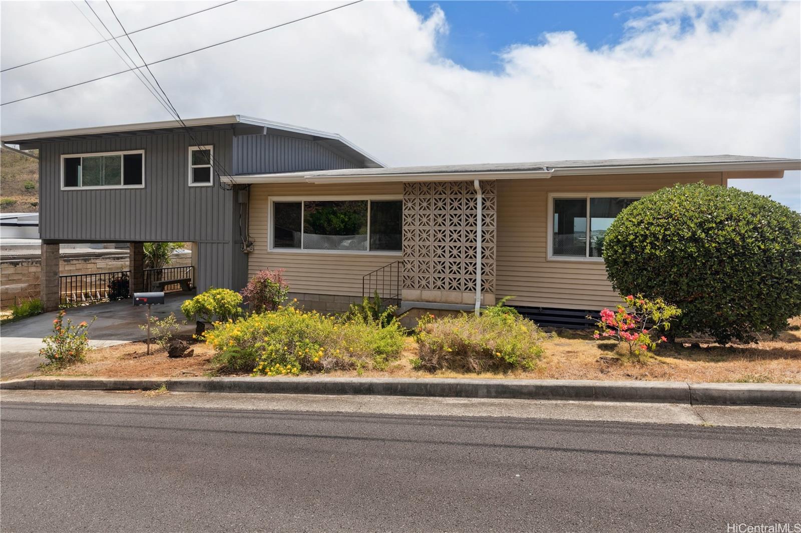 Front view of home with a 2-car carport