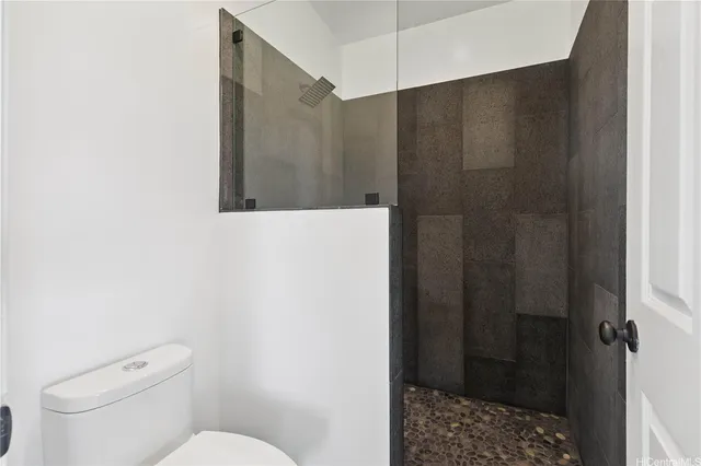 a view of a roof deck with couches and potted plants