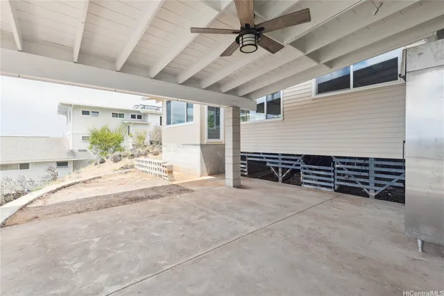 a view of a garden with lawn chairs