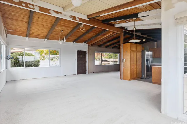 a view of empty room with wooden cabinet