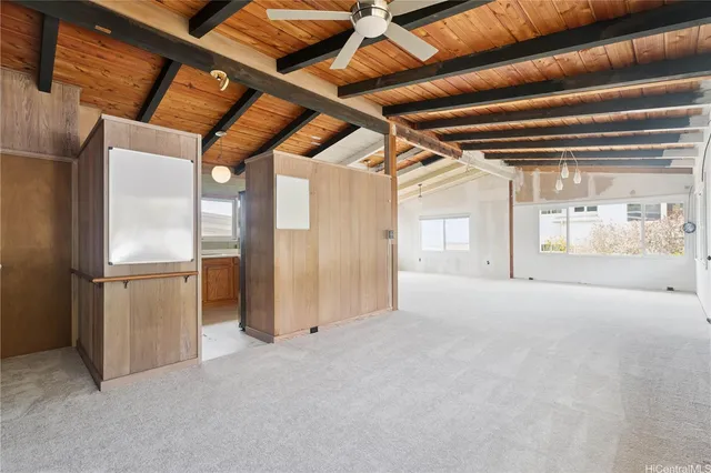 a big room with closet and windows