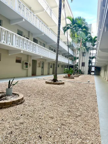 a swimming pool with outdoor seating and yard