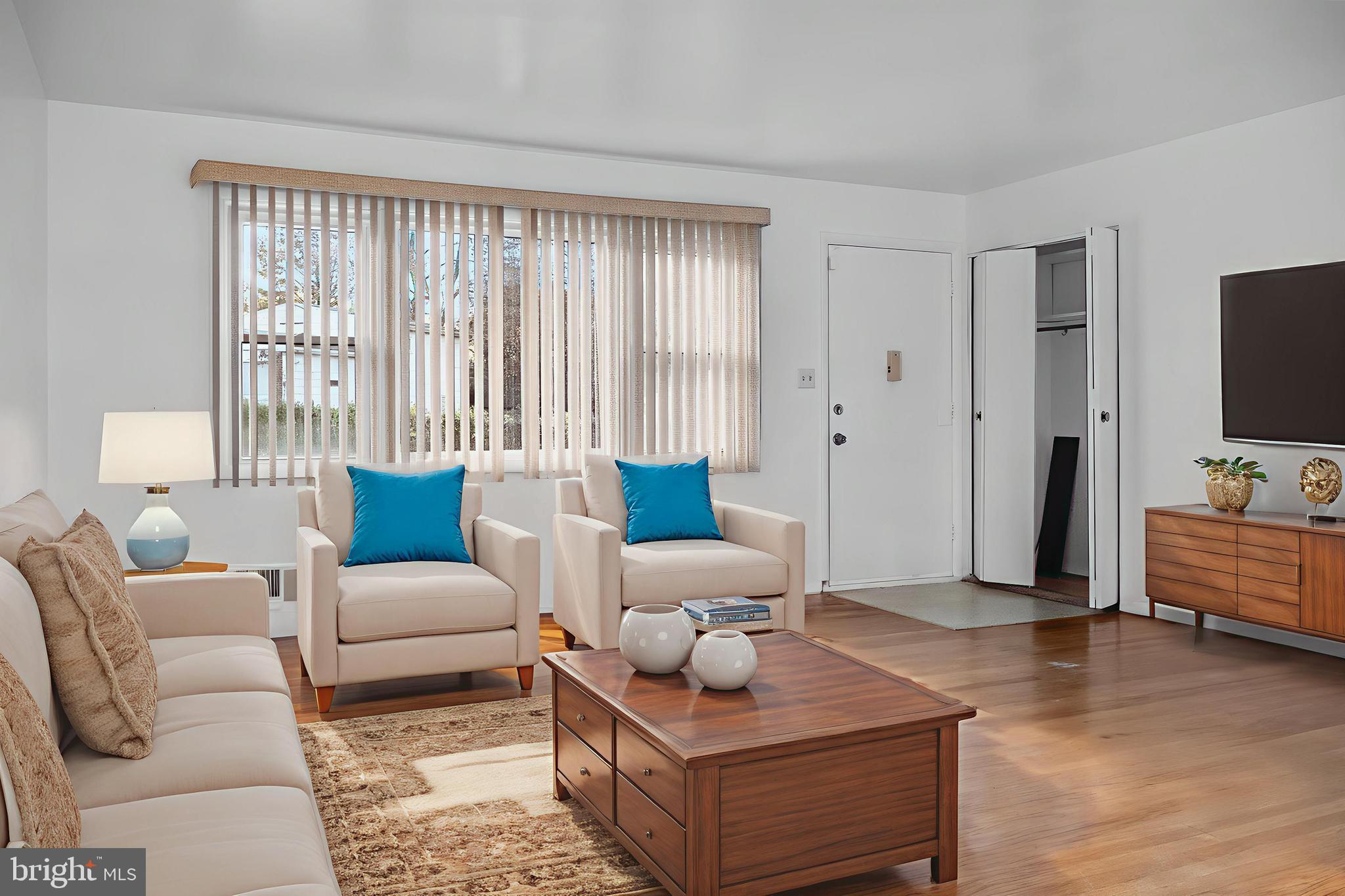 a living room with furniture and a flat screen tv