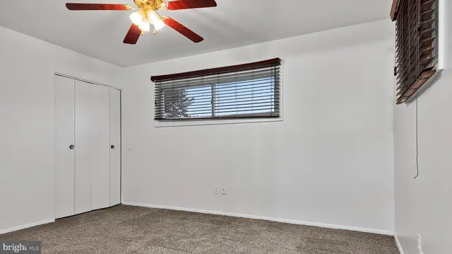 a view of a hallway with a bathroom