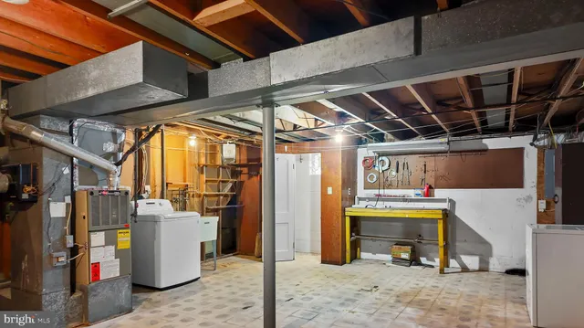 a view of a refrigerator and a table in a room