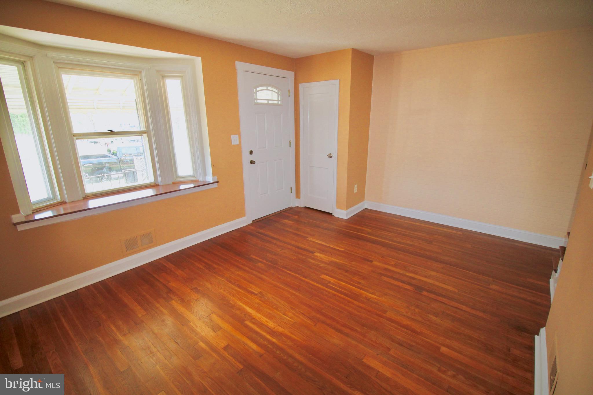 8118 Kavanagh Road Baltimore, MD 21222 - Photo 4 of 23 Living Room with large Bow Window