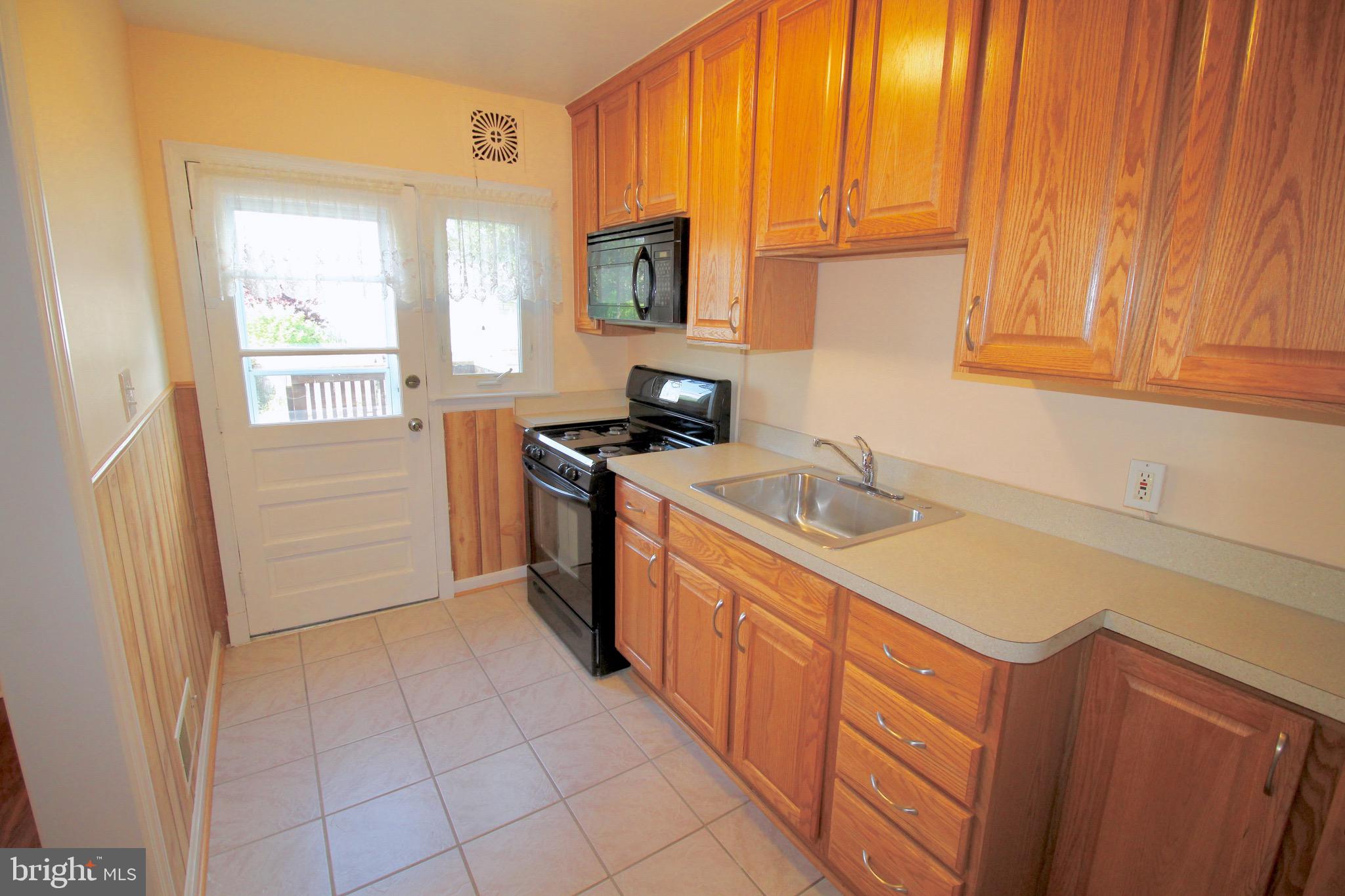 8118 Kavanagh Road Baltimore, MD 21222 - Photo 8 of 23 Kitchen with rear entrance