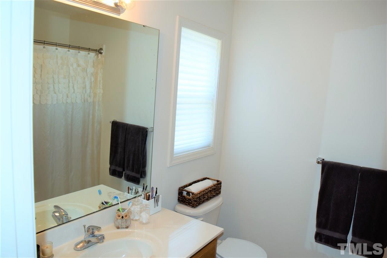 3917 Howard Circle Raleigh, NC 27604 - Photo 12 of 16 a bathroom with a sink and a mirror