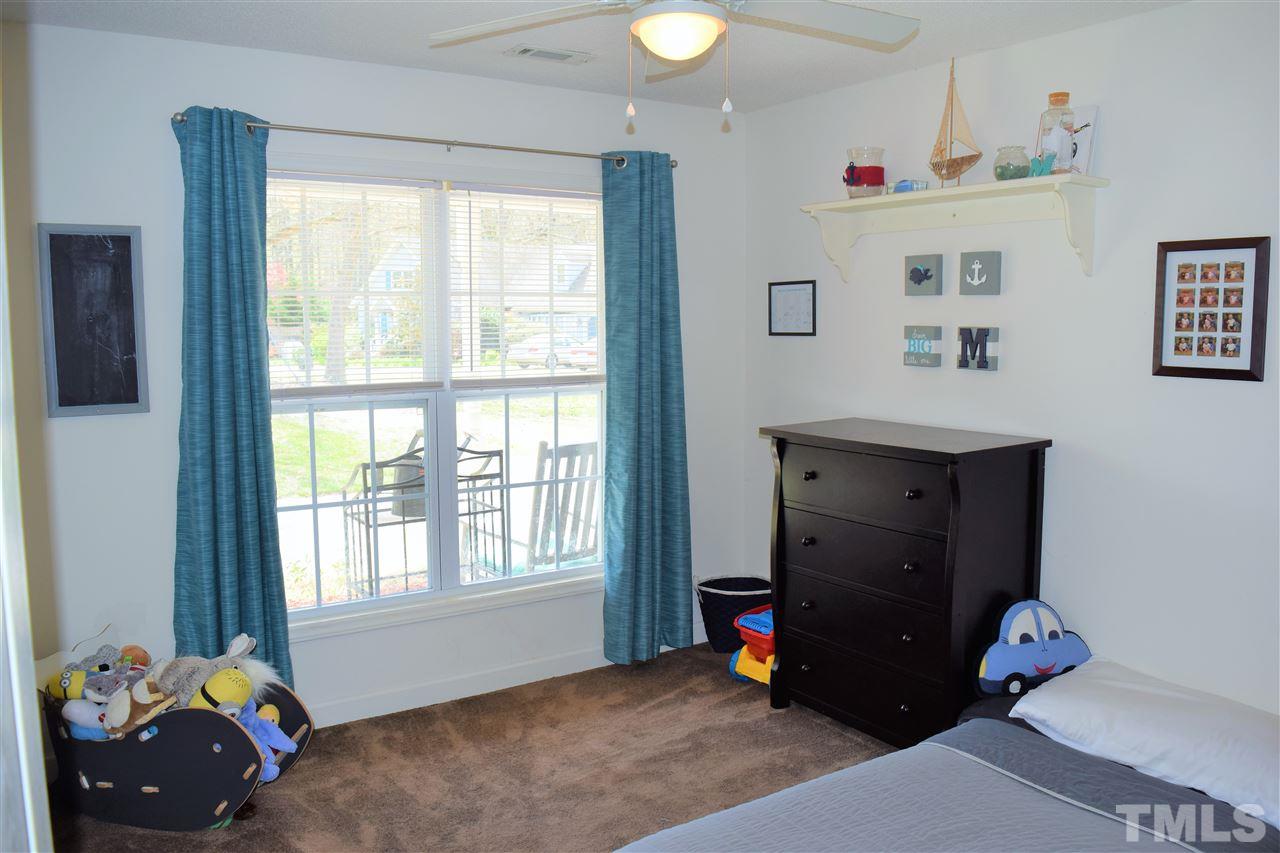 3917 Howard Circle Raleigh, NC 27604 - Photo 13 of 16 a bedroom with a bed and a window