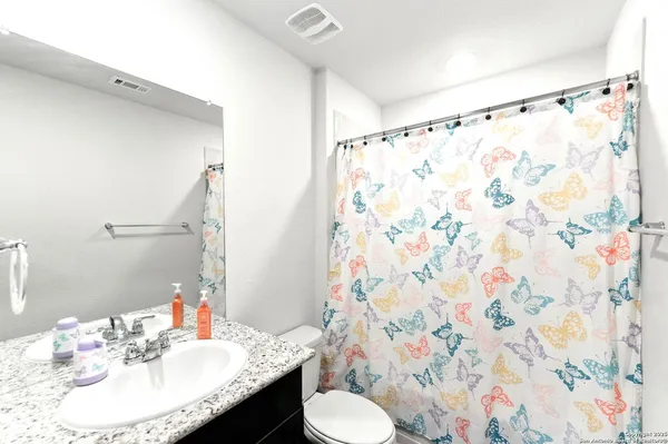 a bathroom with a sink and toilet