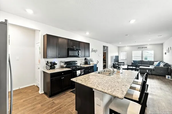 a kitchen with sink cabinets and counter top space