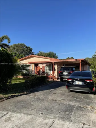 a view of a car parked in front of a house