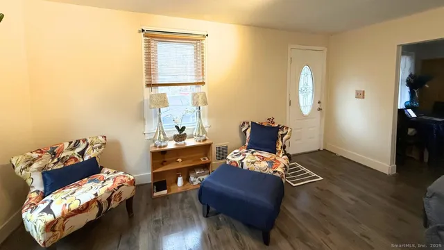 a room with furniture and wooden floor