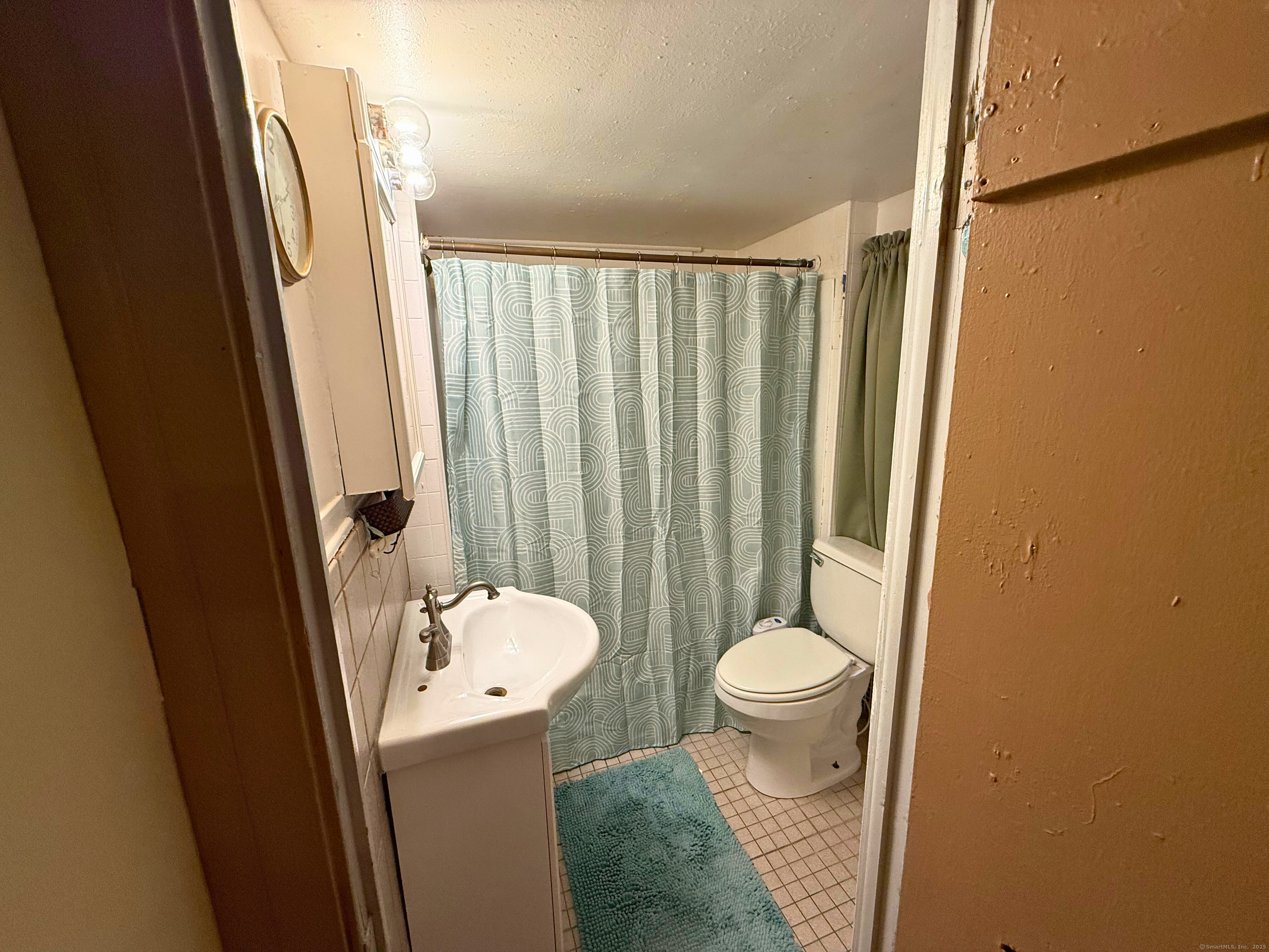 57 Austin Street New Haven, CT 06515 - Photo 13 of 18 a bathroom with a sink toilet and shower