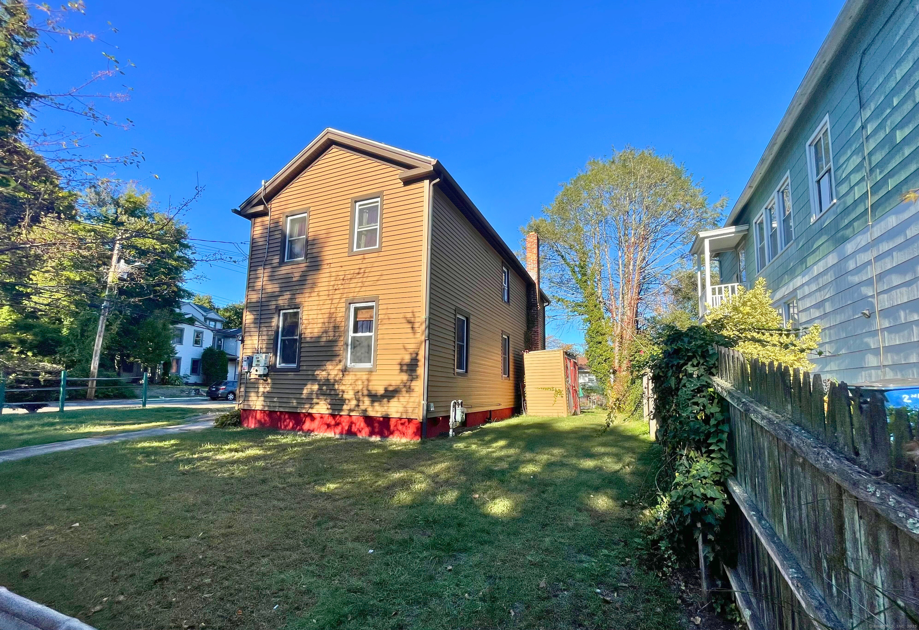 57 Austin Street New Haven, CT 06515 - Photo 2 of 18 a view of a house with a backyard