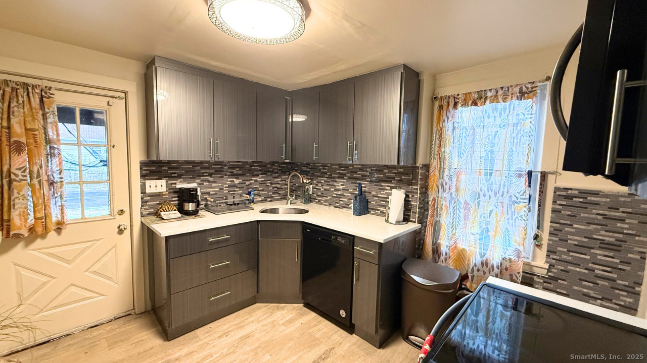 57 Austin Street New Haven, CT 06515 - Photo 4 of 18 a kitchen with a sink and cabinets