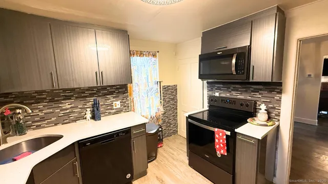 a kitchen with a stove and a sink