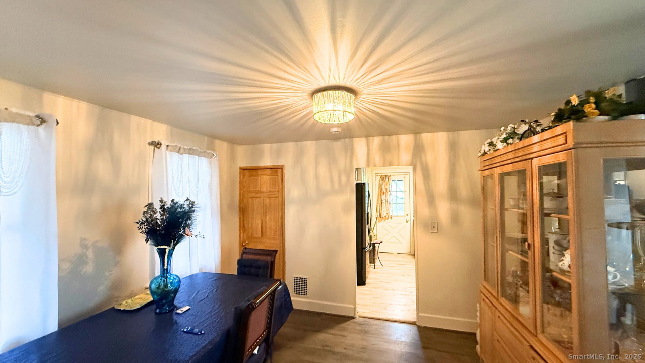 57 Austin Street New Haven, CT 06515 - Photo 7 of 18 a view of a workspace with furniture and wooden floor