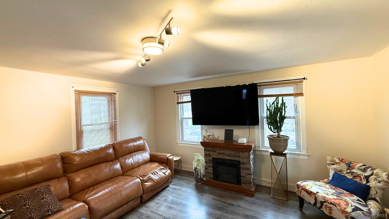 57 Austin Street New Haven, CT 06515 - Photo 10 of 18 a living room with furniture and a flat screen tv