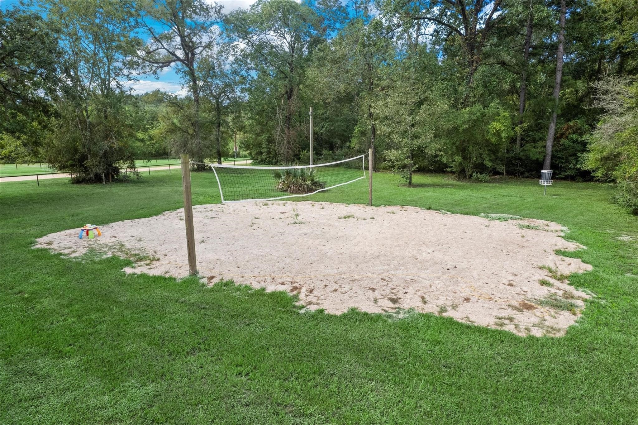 2408 Hollowbrook Lane Conroe, TX 77384 - Photo 46 of 49 Volleyball anyone? Disc Golf course set up.